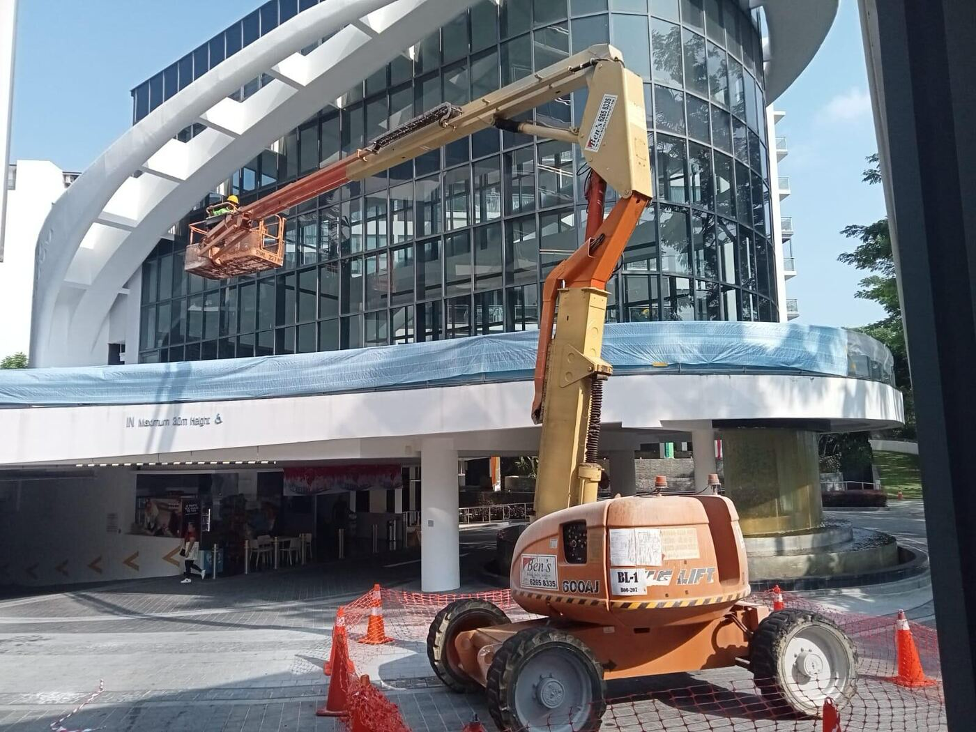 Façade inspectors on site reviewing an external building elevation